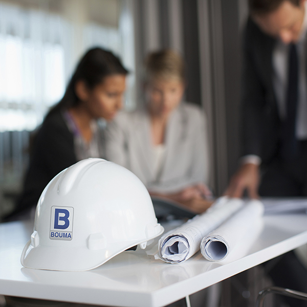 Image of People Reviewing Plans with Hard Hat